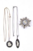 A collection of silver and white metal necklaces.
