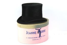 A gentleman's vintage silk top hat by Dunn & Co. With leather and silk lining, comes with a box.