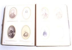 A large Victorian leather bound and gold gilt photograph album with 124 Cdv and cabinet photos