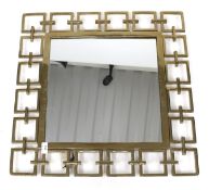 A contemporary gilt metal square framed wall mirror.