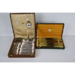 Two French Art Deco sets of silver-plated cutlery.