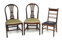 A pair of mahogany framed upholstered dining chairs plus one other.