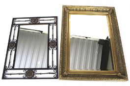 Two assorted contemporary wall mirrors.