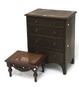 A small Edwardian mahogany chest of drawers and a stool.