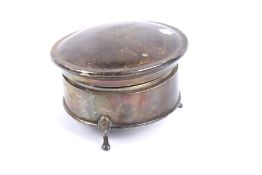 A silver round trinket box.