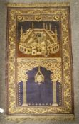 A vintage Islamic prayer rug. Depicting Mecca.