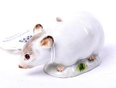 A Meissen porcelain figure of a mouse.