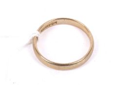 A 9ct gold wedding band. Post 2000 convention hallmarks, size M.