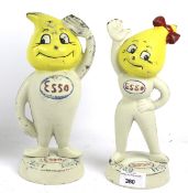 A pair of painted metal Esso figures.