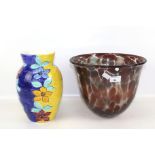 A contemporary glass vase and a china vase.