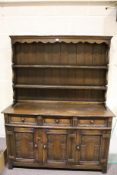 A vintage dark oak dresser. With three drawers and three cupboard doors to the base.