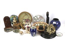 An assortment of collectables. Including carvings, a Royal Copenhagen vase, shells, etc.
