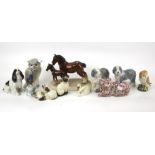 A collection of assorted ceramic animal figures.