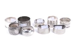 Nine silver and white metal napkin rings.