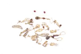 A collection of mostly 9ct gold and gem set earrings.