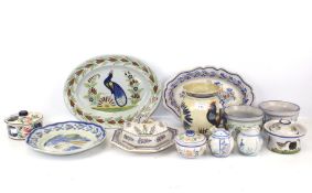 A collection of Quimper ceramics. Including a vase decorated with chicken, a lidded pot, jug, etc.