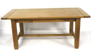 A contemporary pine refectory style table.