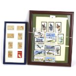 A collection of assorted vintage cigarette cards.