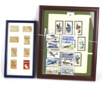 A collection of assorted vintage cigarette cards.