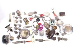 A collection of small silver and objects.