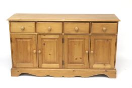 A contemporary pine sideboard.