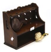 A vintage oak pipe stand rack and boxed Mersham pipe.