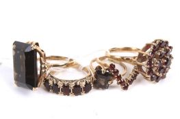 Five 9ct gold and gem set dress rings.