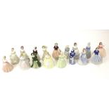 A collection of sixteen assorted Wade My Fair Ladies porcelain figures.