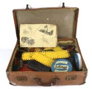 Collection of assorted vintage Meccano parts and pieces in a case.