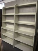 A pair of contemporary grey wooden bookcases.