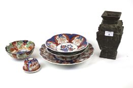 A selection of oriental ceramics and a cast metal vase.