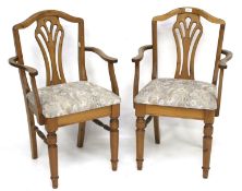 A pair of contemporary pine carver upholstered chairs.