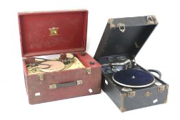 Two vintage portable record players.