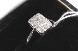 A mid 20th century gold and diamond rectangular cluster ring.