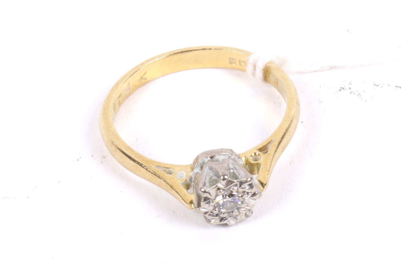 An 18ct gold and diamond solitaire ring. The round brilliant approx. 0.