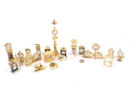 A collection of 22 brass cased miniature novelty clocks/timepieces.