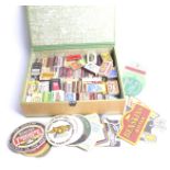 An assorted matchbox and beer mat collec