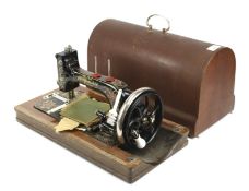 A vintage hand crank sewing machine case