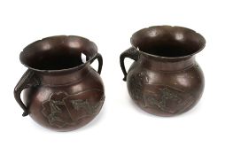 A pair of 20th century Chinese cast metal pots.