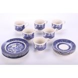 A set of Churchill 'Willow' pattern tea cups and saucers. A trio for six people.