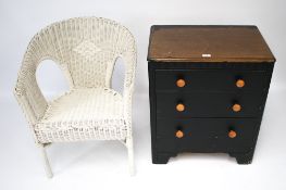 A vintage Lloyd Loom elbow chair and wooden chest of drawers.