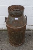 A vintage twin handled milk churn. Stamped 'C.W.S.