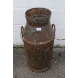 A vintage twin handled milk churn. Stamped 'C.W.S.