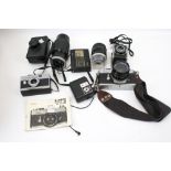 An assortment of vintage camera equipment and accessories.