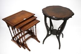 A nest of three tables and an occasional table.