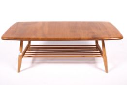 Vintage / Retro : A Blonde Elm topped Ercol coffee table with gold label.