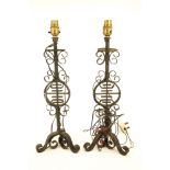 A pair of wrought iron table lamps with a central Chinese shou character.