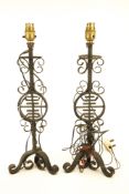 A pair of wrought iron table lamps with a central Chinese shou character.