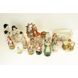 A collection of Staffordshire pottery figures.