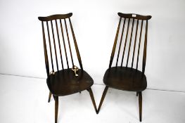 A pair of Ercol stained elm chairs.